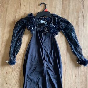 Black glitter costume with feathers